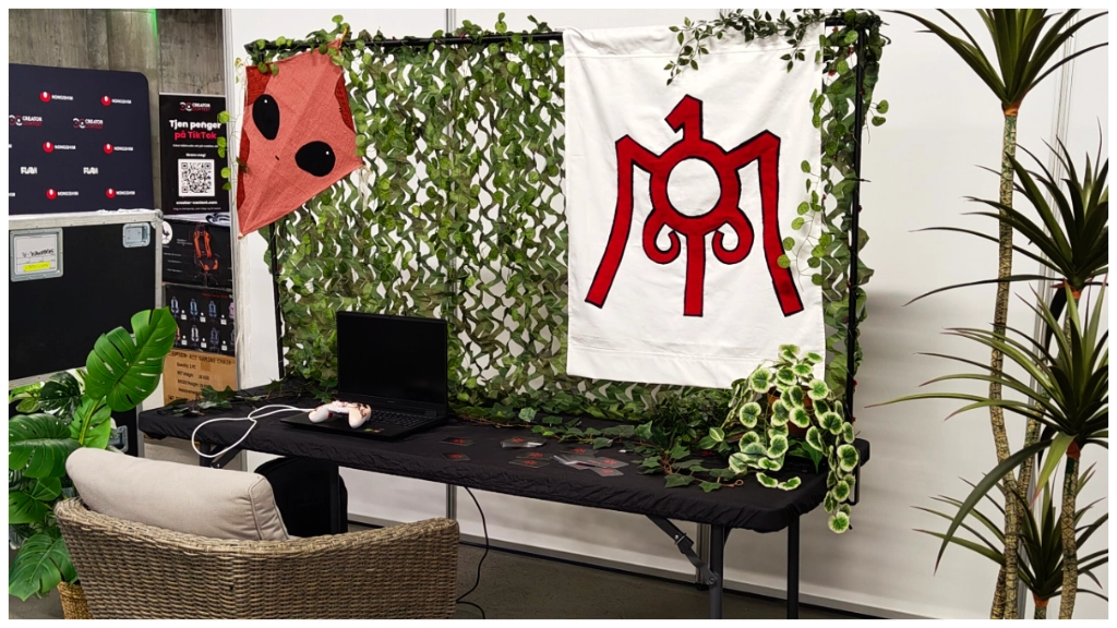 The Myte Interactive stand at PLAY! Expo Bergen, featuring a cozy, overgrown free-play setup.